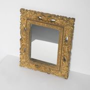Decorative gold mirror mid-century in a wooden frame, Italy, 1960s.