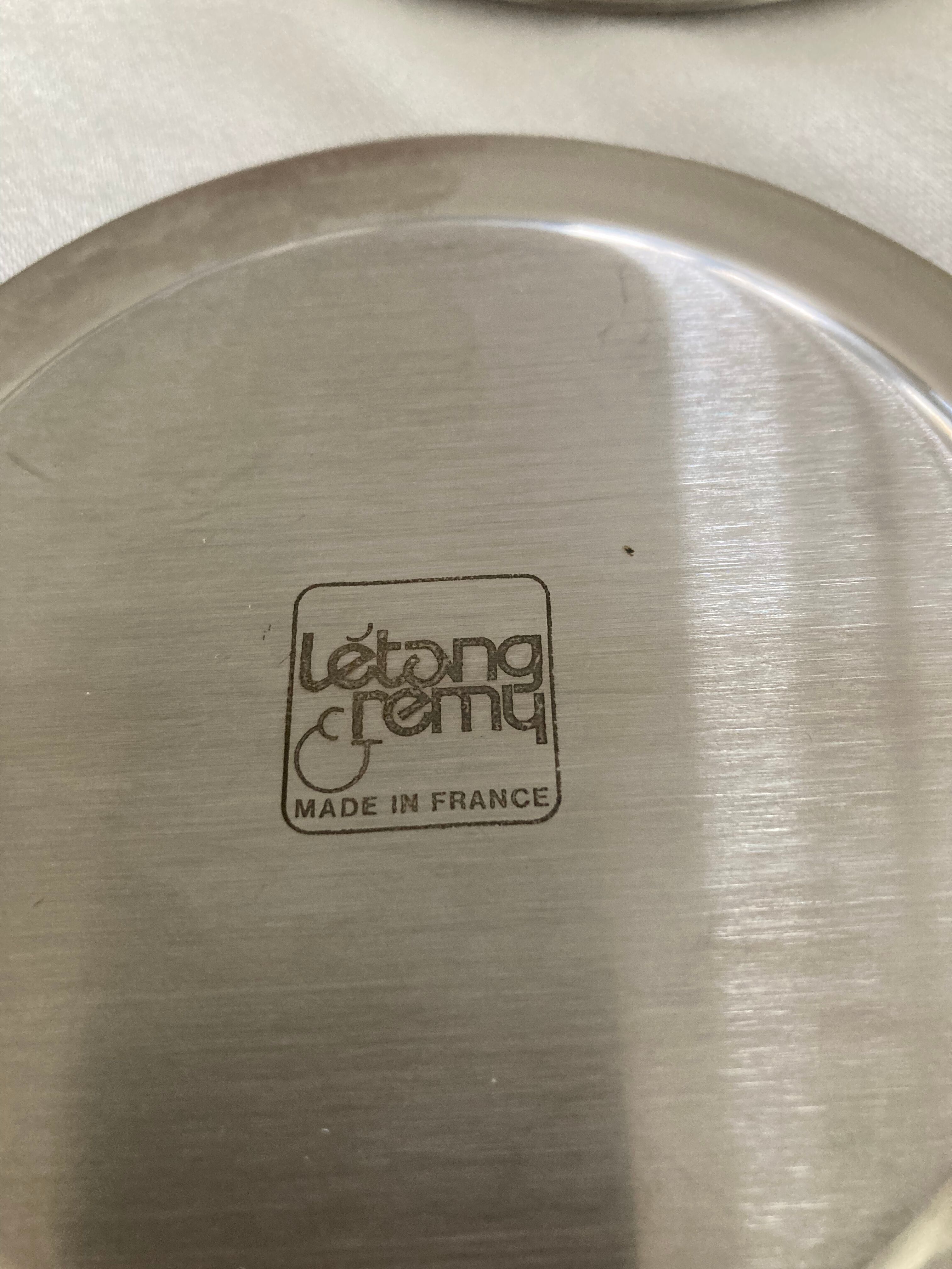 Pair of stainless steel bottle coasters létang and rémy