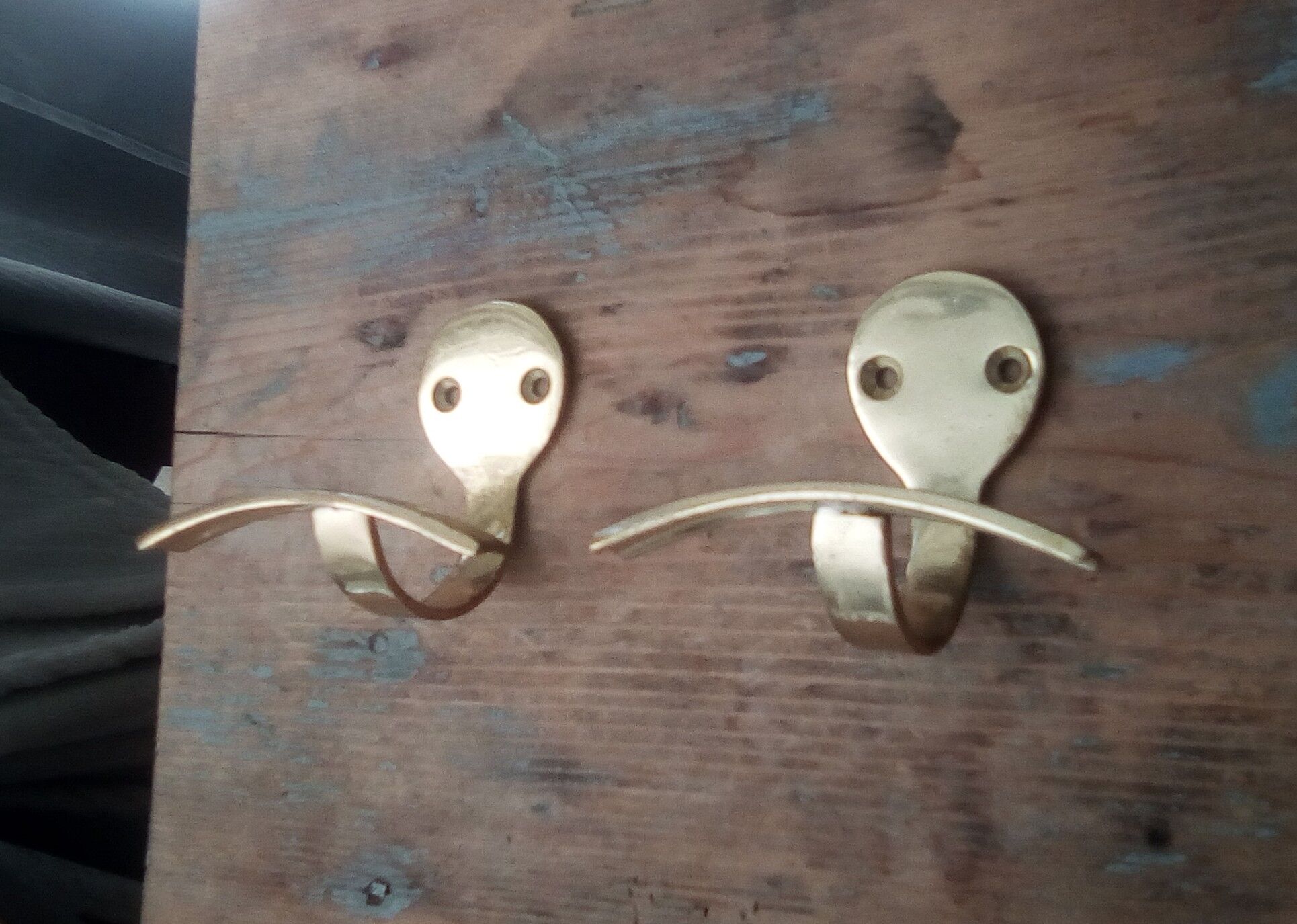 Pair of coat racks in gilded steel 70s/80s