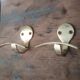 Pair of coat racks in gilded steel 70s/80s