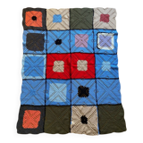 Hand-knitted patchwork blanket