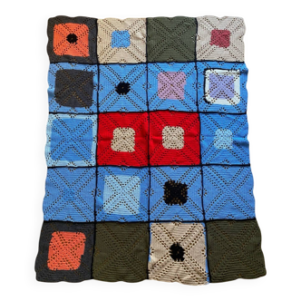 Hand-knitted patchwork blanket