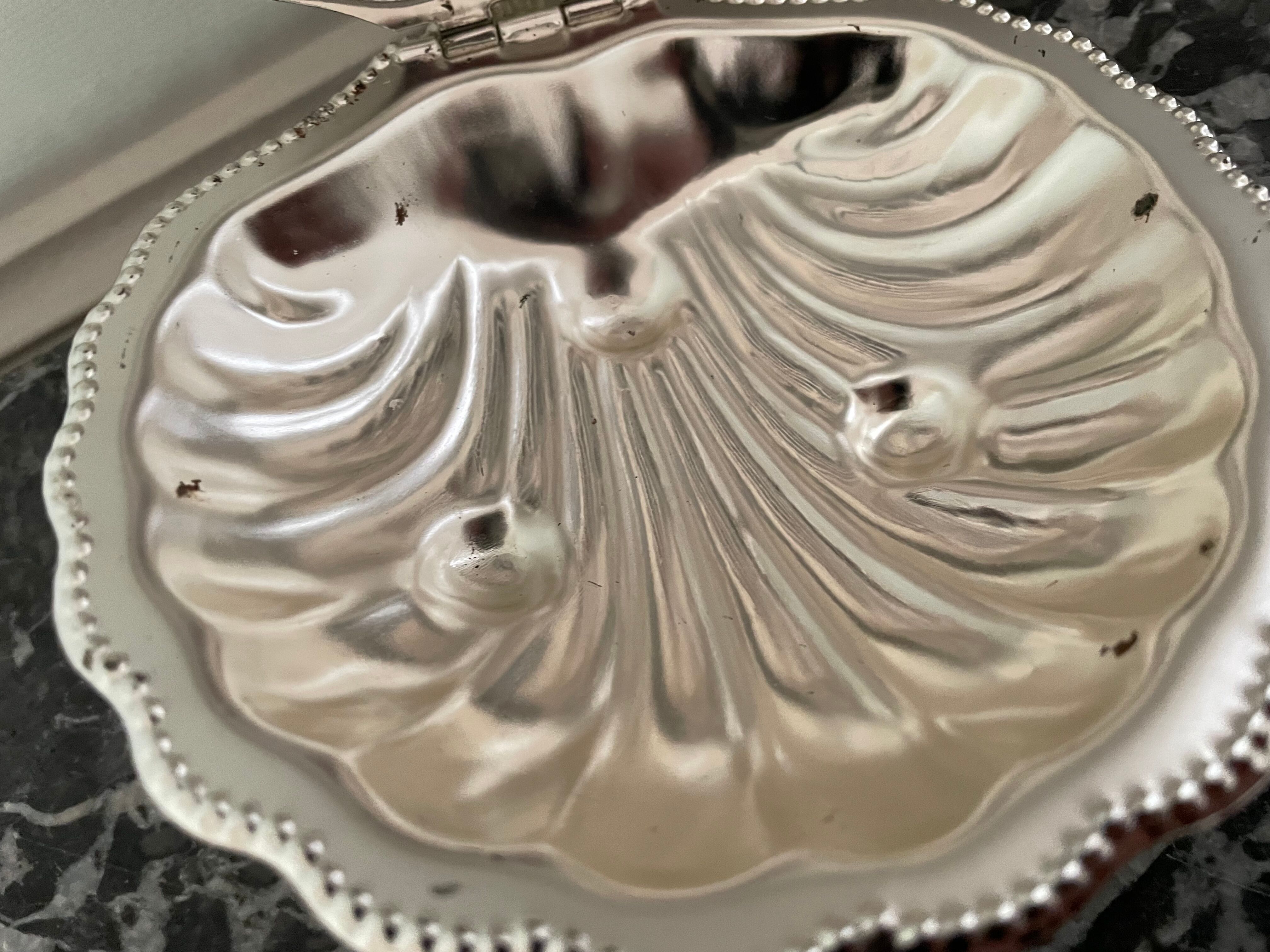 Shell-shaped metal butter dish
