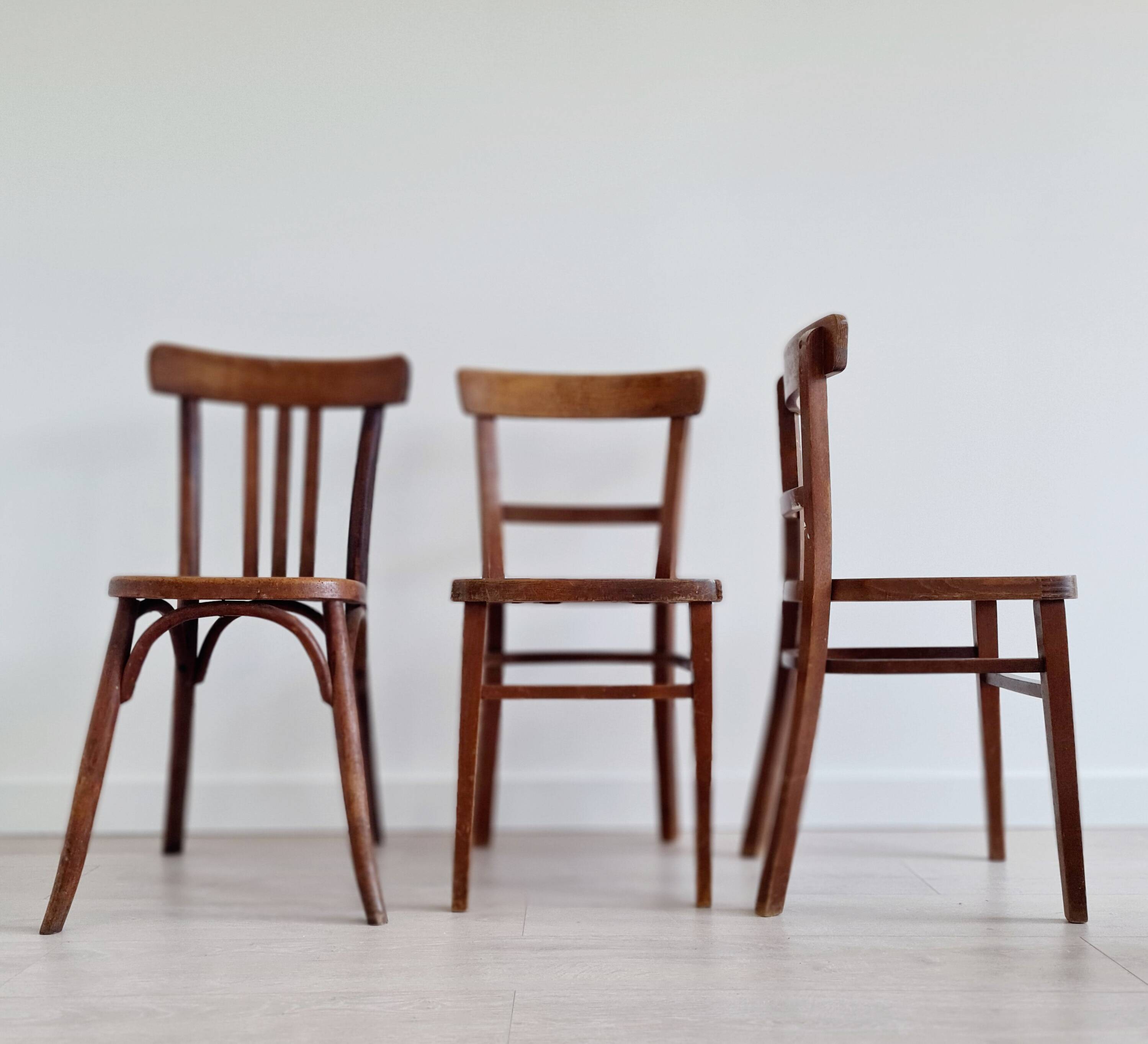 Mismatched wooden bistro chairs
