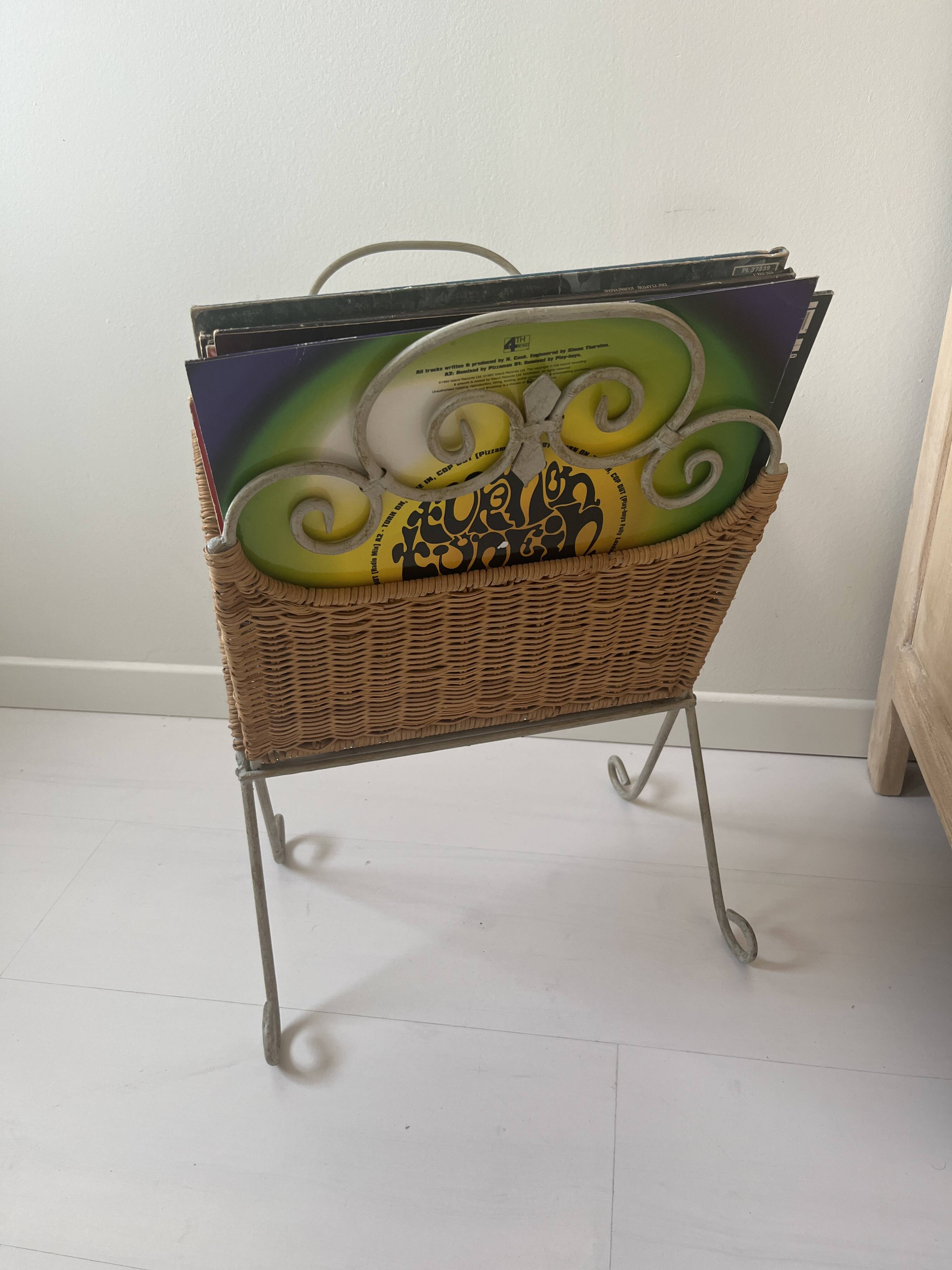 Rattan and shabby wrought iron magazine rack