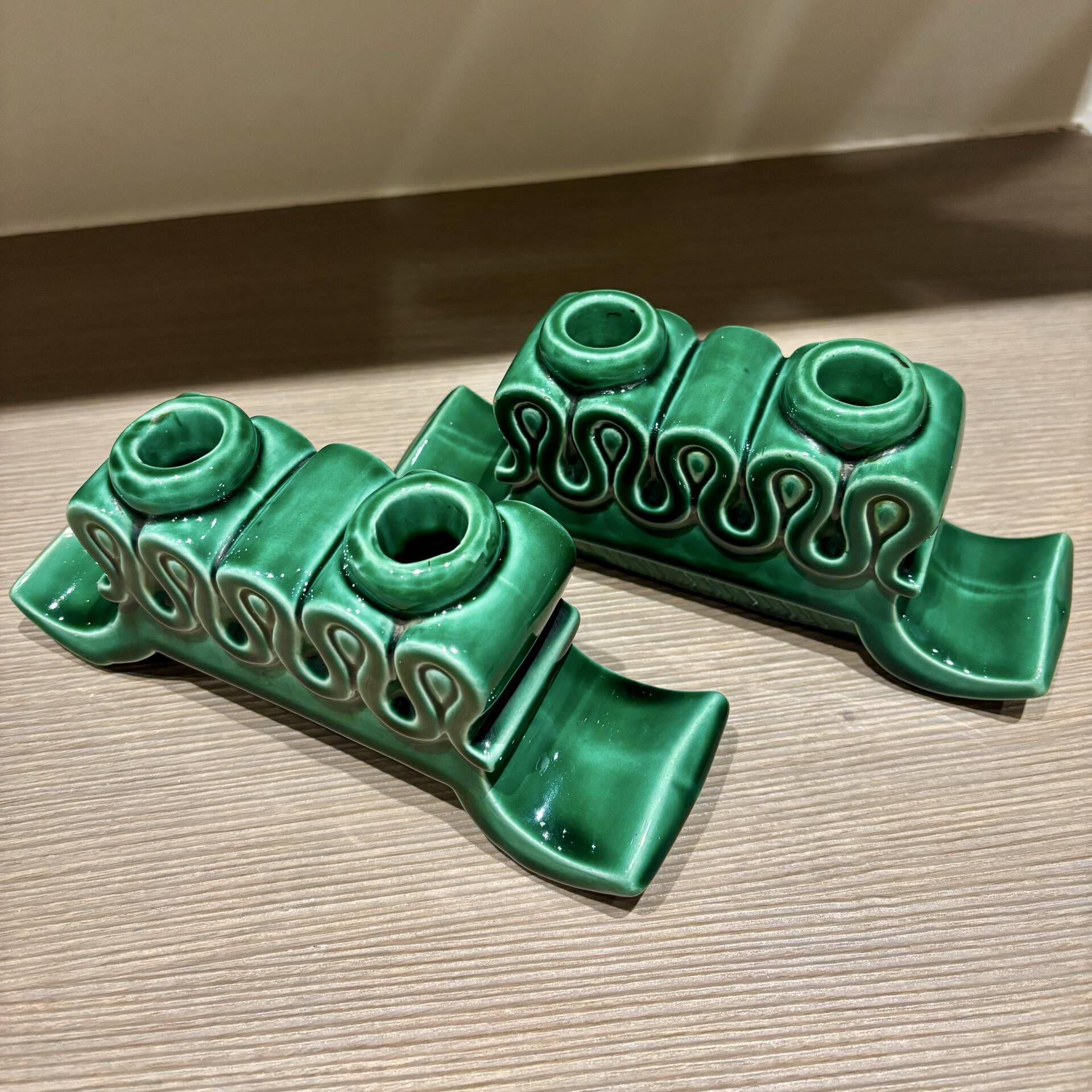 Pair of Art Deco green ceramic candlesticks