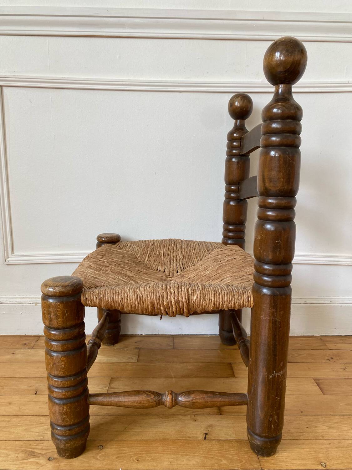 Low fireplace chair in the style of Charles Dudouyt