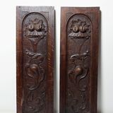 Pair of decorative wall panels in carved wood from the 19th century.