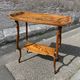 Art Nouveau period two-tiered tea table in veneered wood, signed Émile Gallé