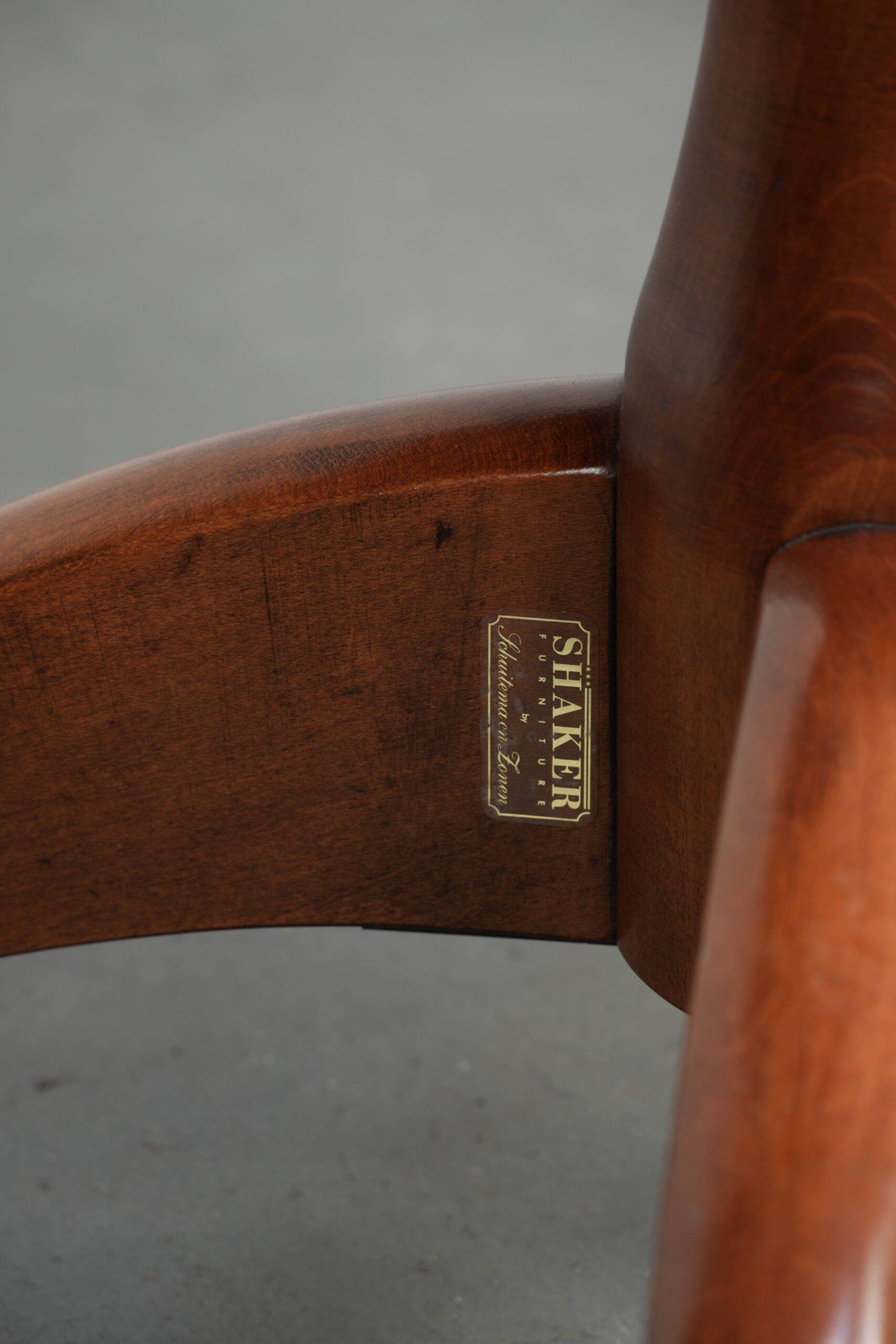 Set of 2 swivel/office chairs with a cognac-coloured cow leather seat