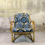 Vintage armchair in rattan and floral fabric