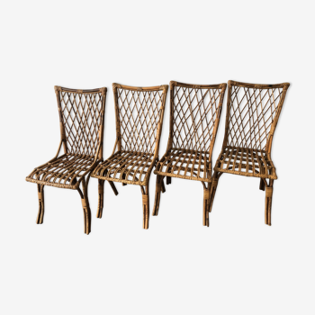 Suite of 4 chairs in rattan by Louis Sognot