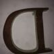 Old letter in metal (sheet metal) "D"