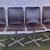Set of 4 metal and imitation leather swivel chairs.