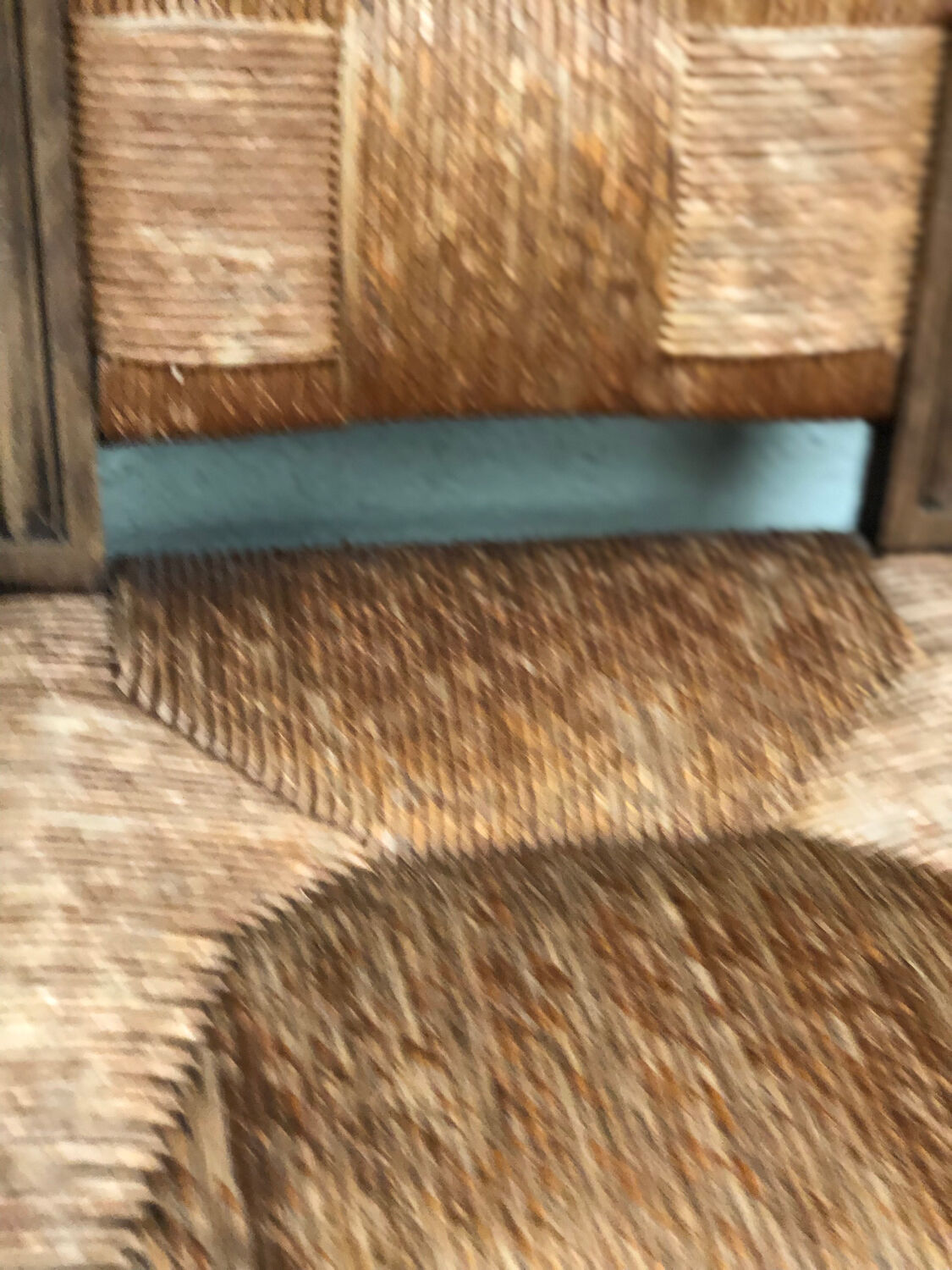 Old straw brutalist chair