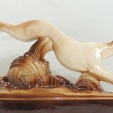 Beige and brown ceramic representing a “Greyhound/vintage 1930