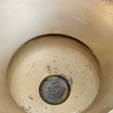 Vintage brass cache-pot on a stand with handles, classic decor.