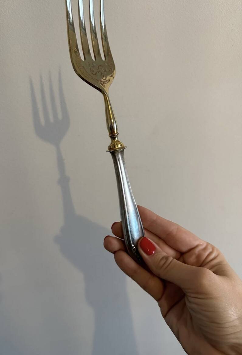 Engraved meat fork in silver and gold metal