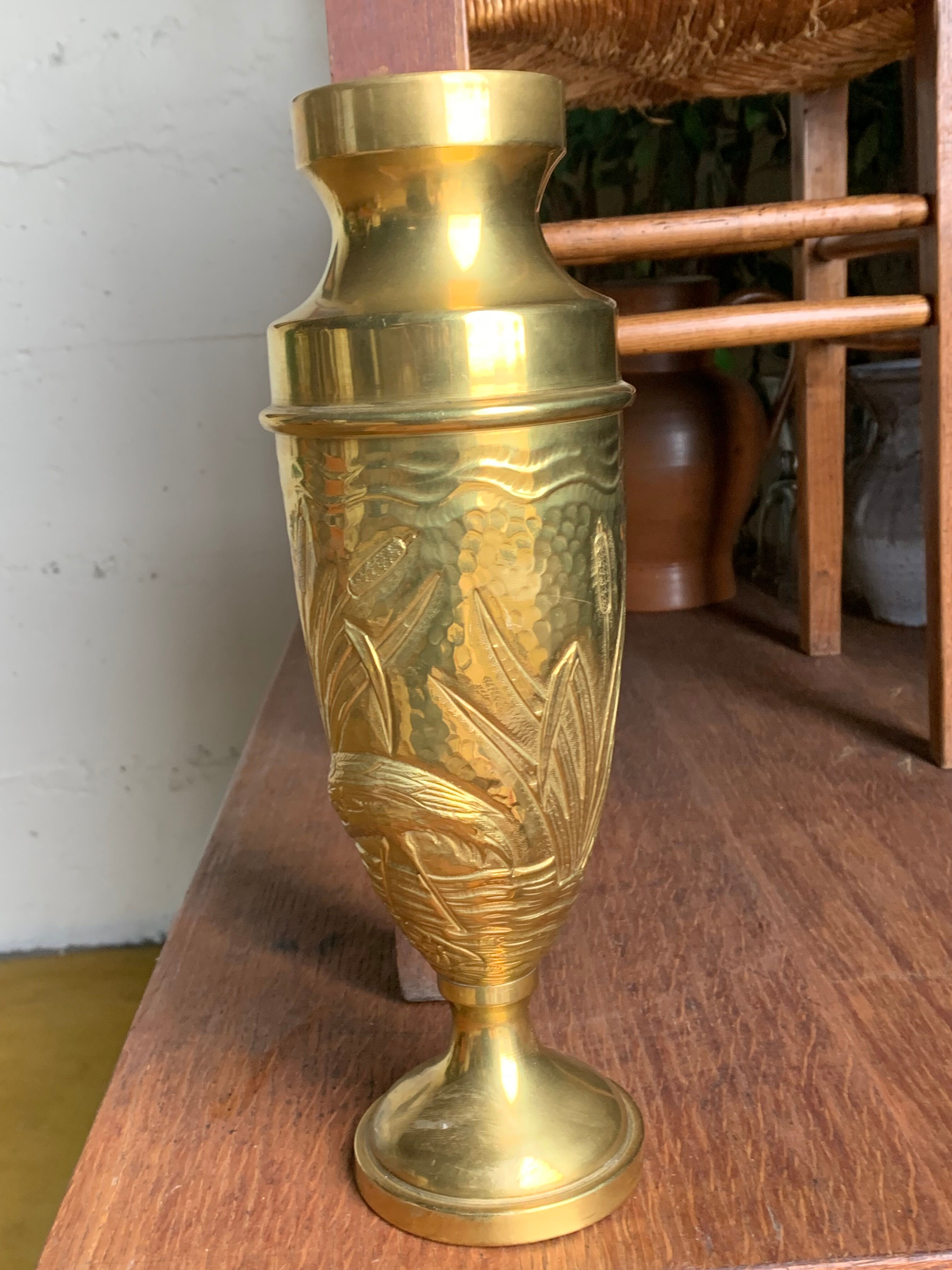 Brass vase with crane decoration