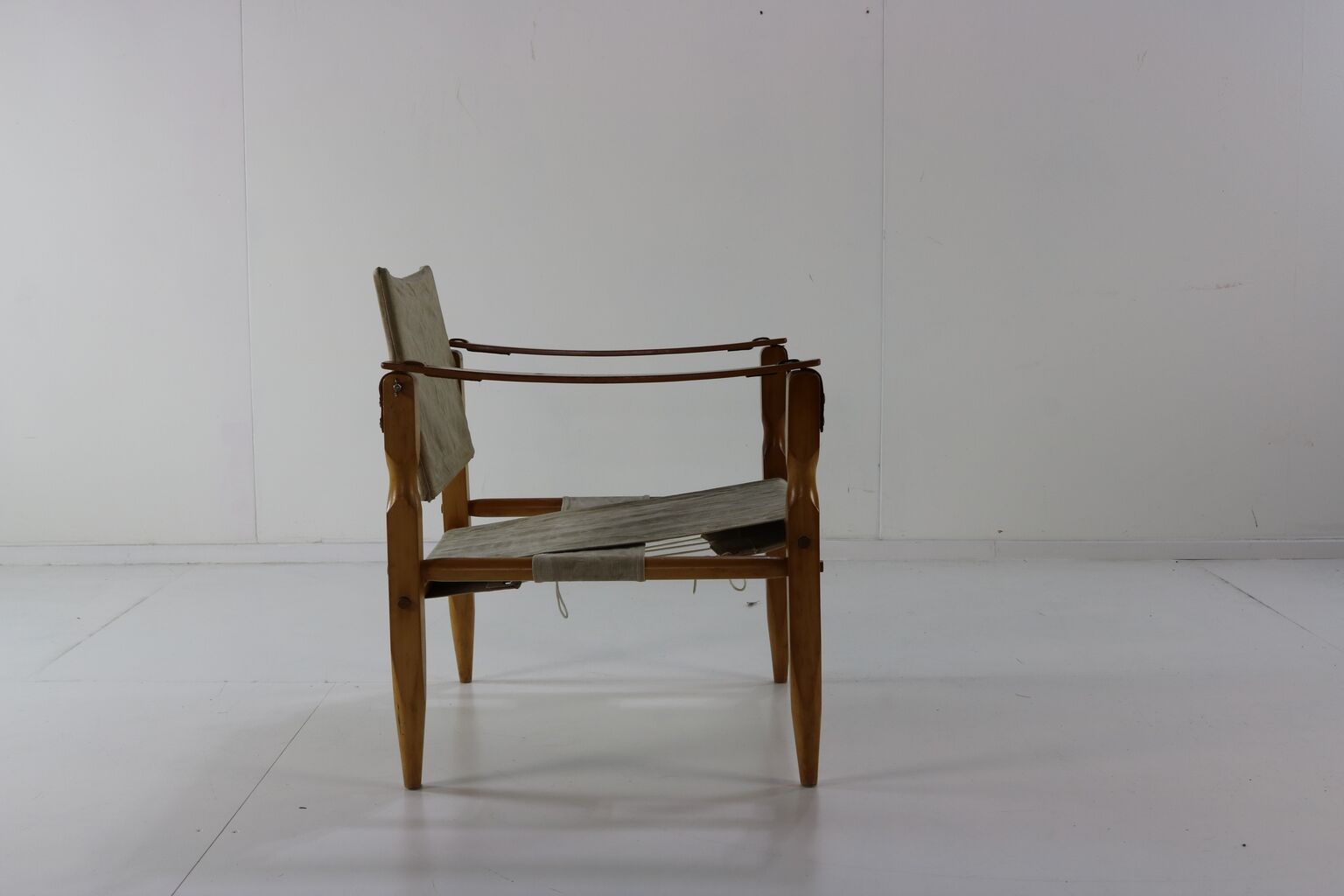 Danish design safari chair with wooden armrests
