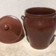 Large glazed terracotta jar, cognac colour with its lid.
