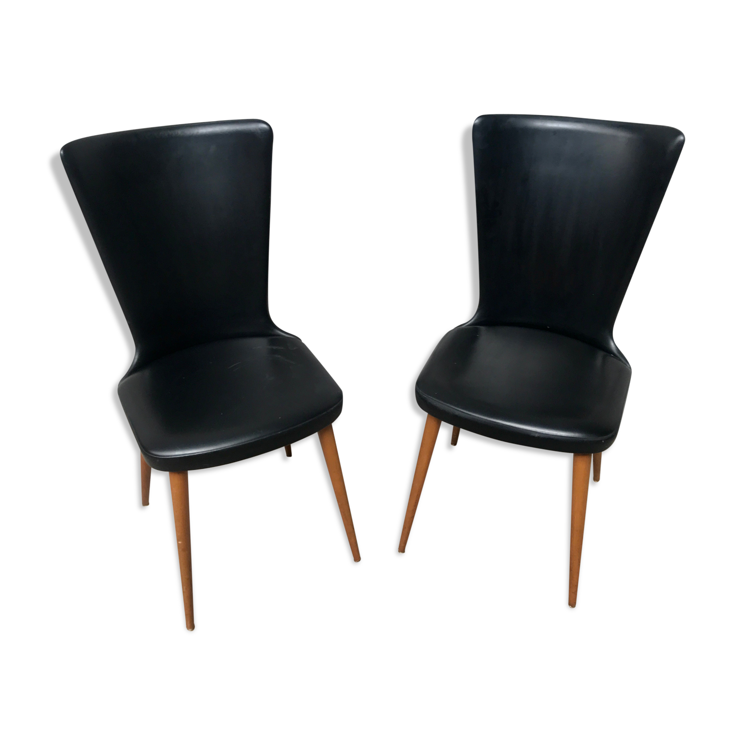 Pair of Baumann model Essor chairs in faux black leather, beech compass footing
