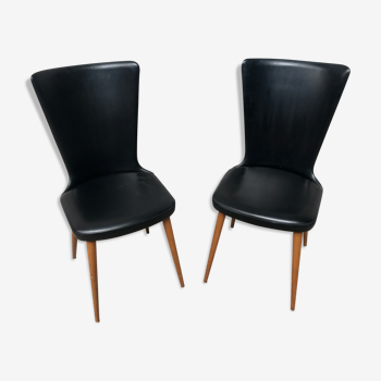 Pair of Baumann model Essor chairs in faux black leather, beech compass footing