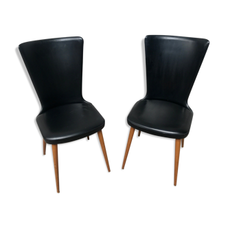 Paire de chaises Baumann modèle Essor en simili cuir noir, piétement compas en hêtre