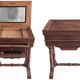 Antique wooden sewing cabinet with mirror and storage.