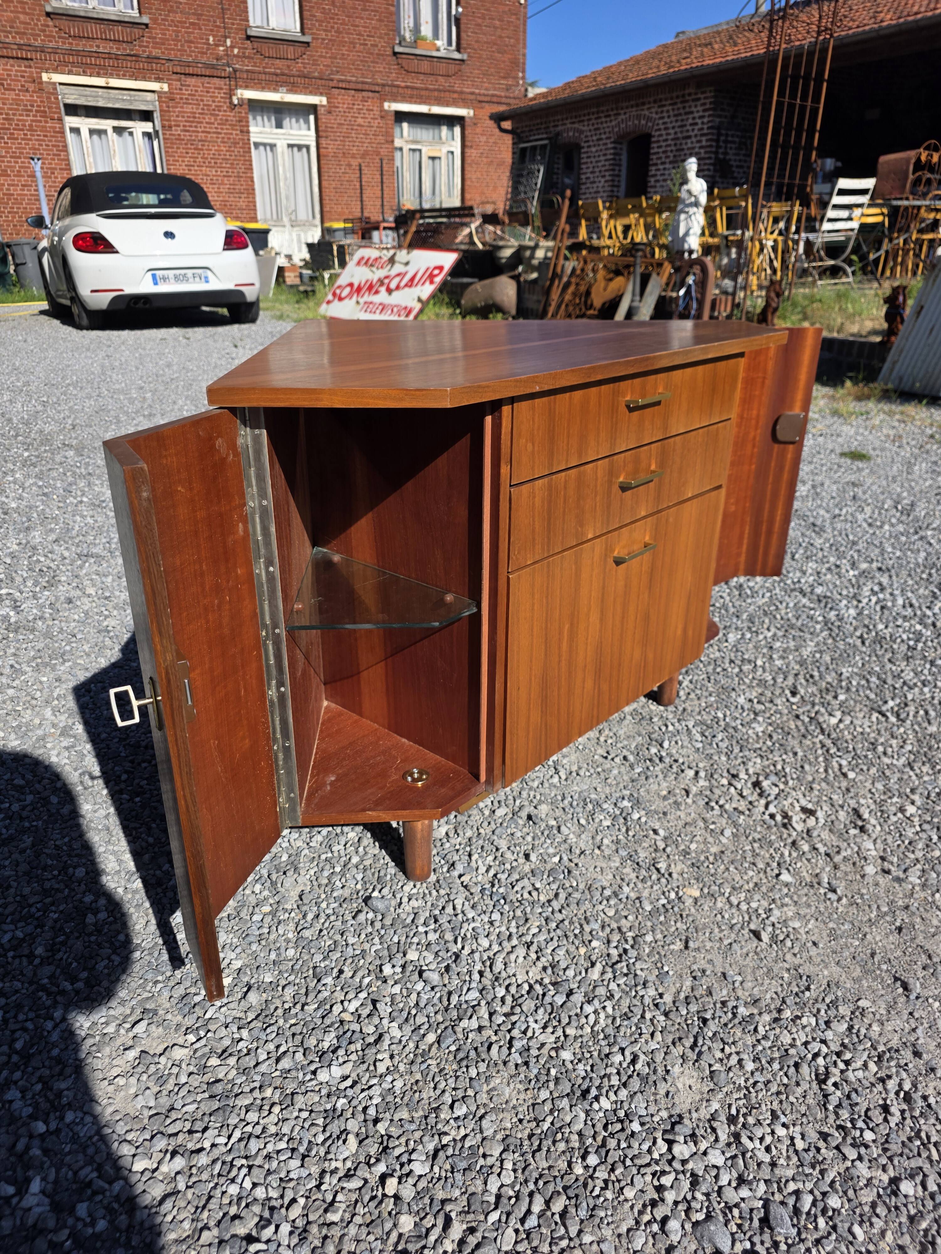 Scandinavian corner unit in teak from the 1960s.