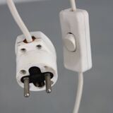 Mid-century modern floor lamp on iron legs with plastic shade and wood accent