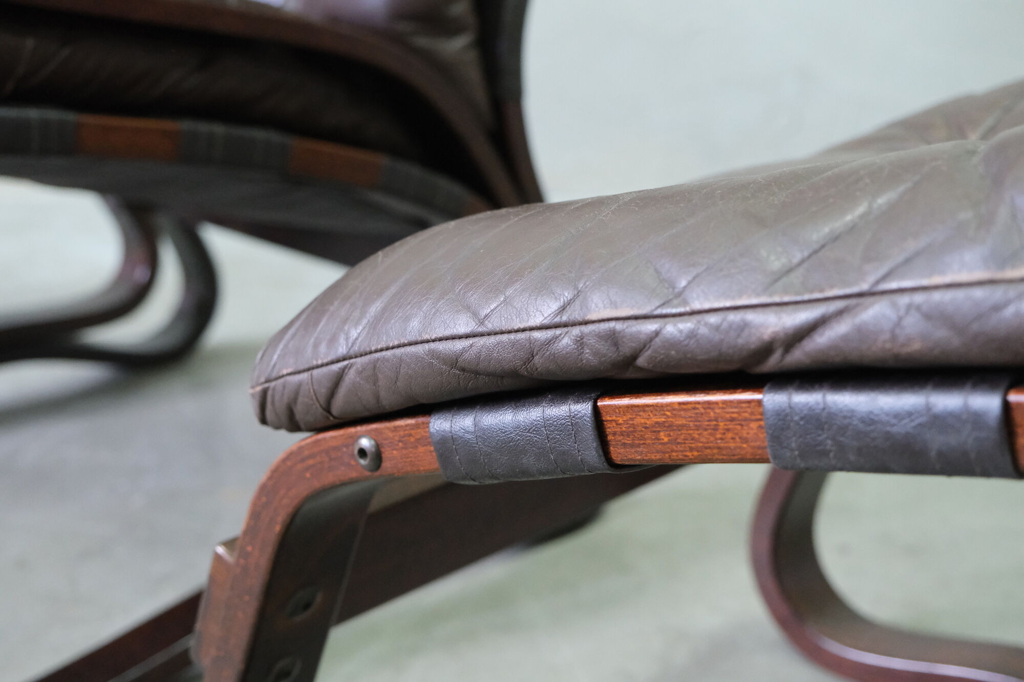 Mid century leather armchair and foot stool by Erda & Nordahl Solheim, Norway 1970's