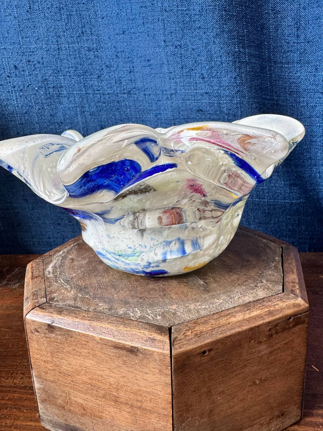 Multi-layer glass ashtray with metallic oxide inclusions.