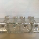 Four old square molded glass candlesticks