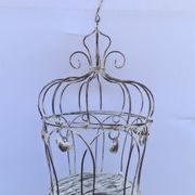 Decorative bird cage with iron hearts