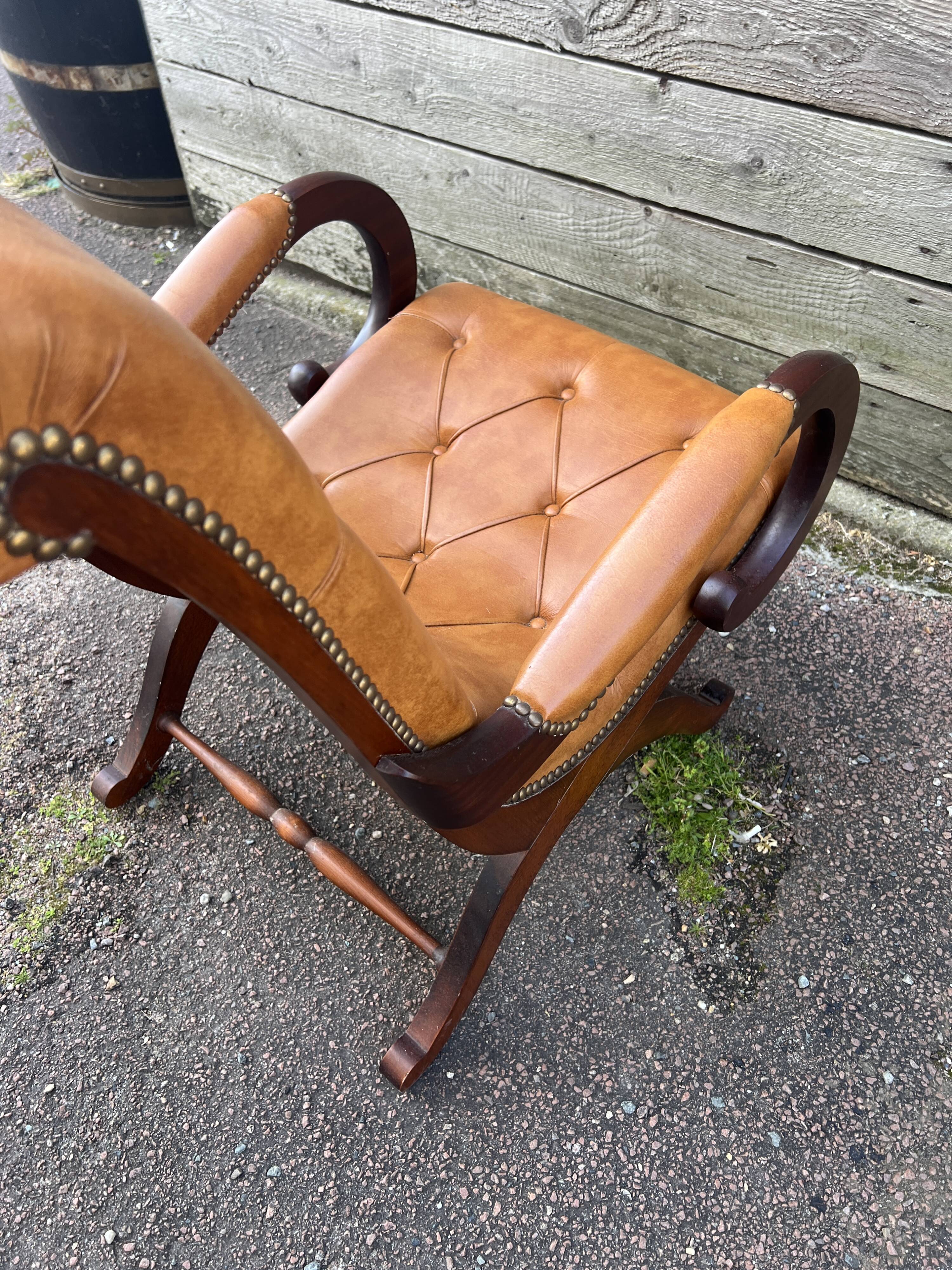 Chesterfield leather slipper chair with mahogany