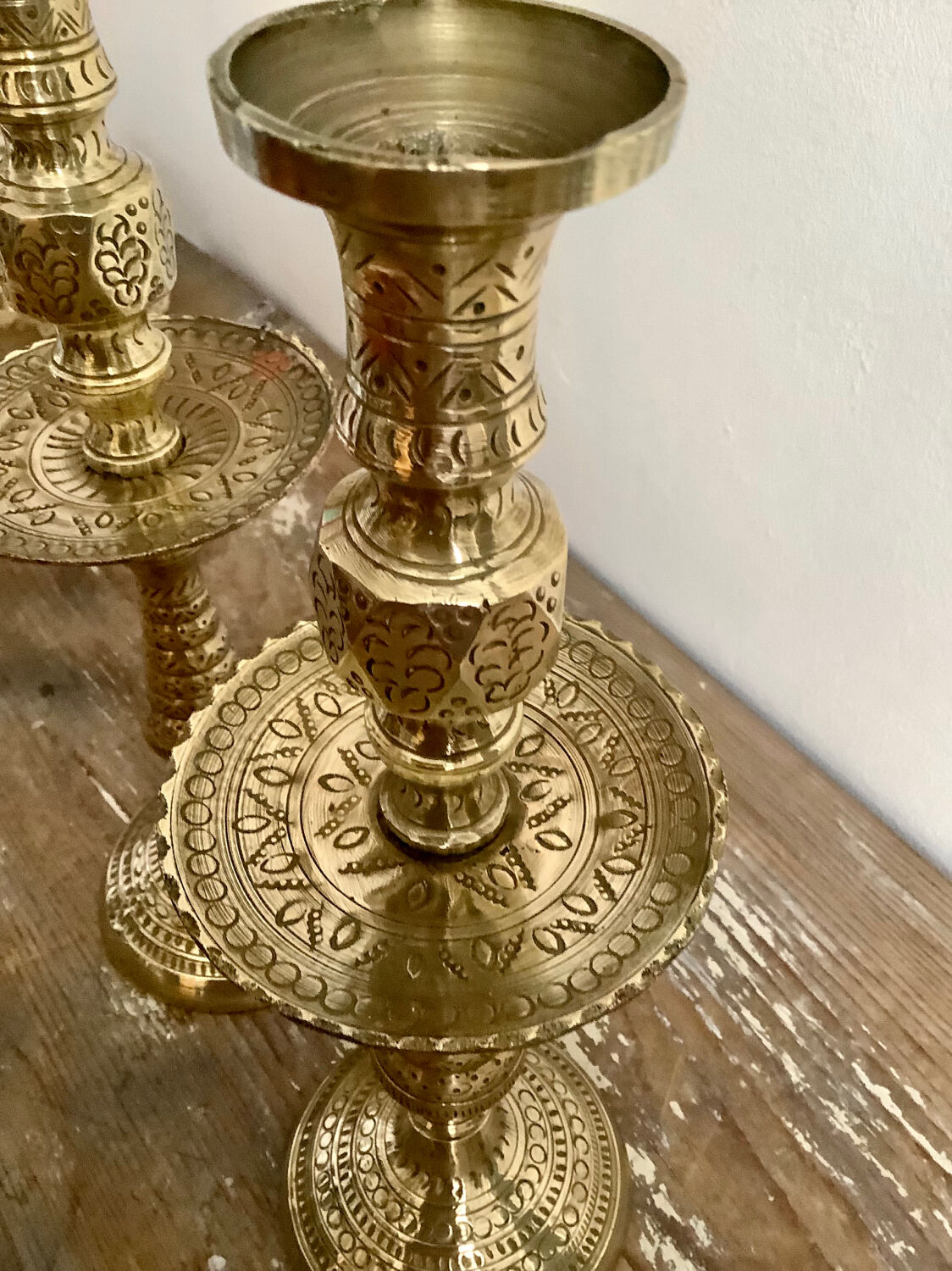 Pair of engraved brass candle holders