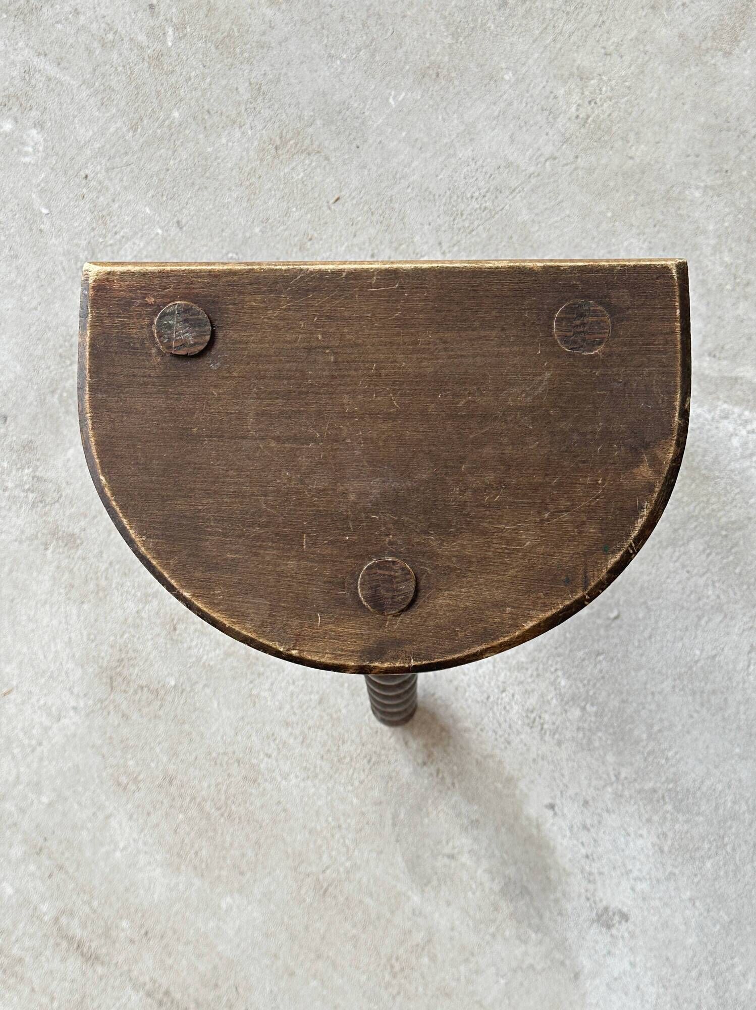 Two French farmhouse stools made of turned wood.