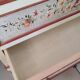 Painted chest of drawers with floral decoration