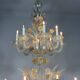 Venetian chandelier in gilded Murano glass, 24 light sources, three tiers, circa 1940.