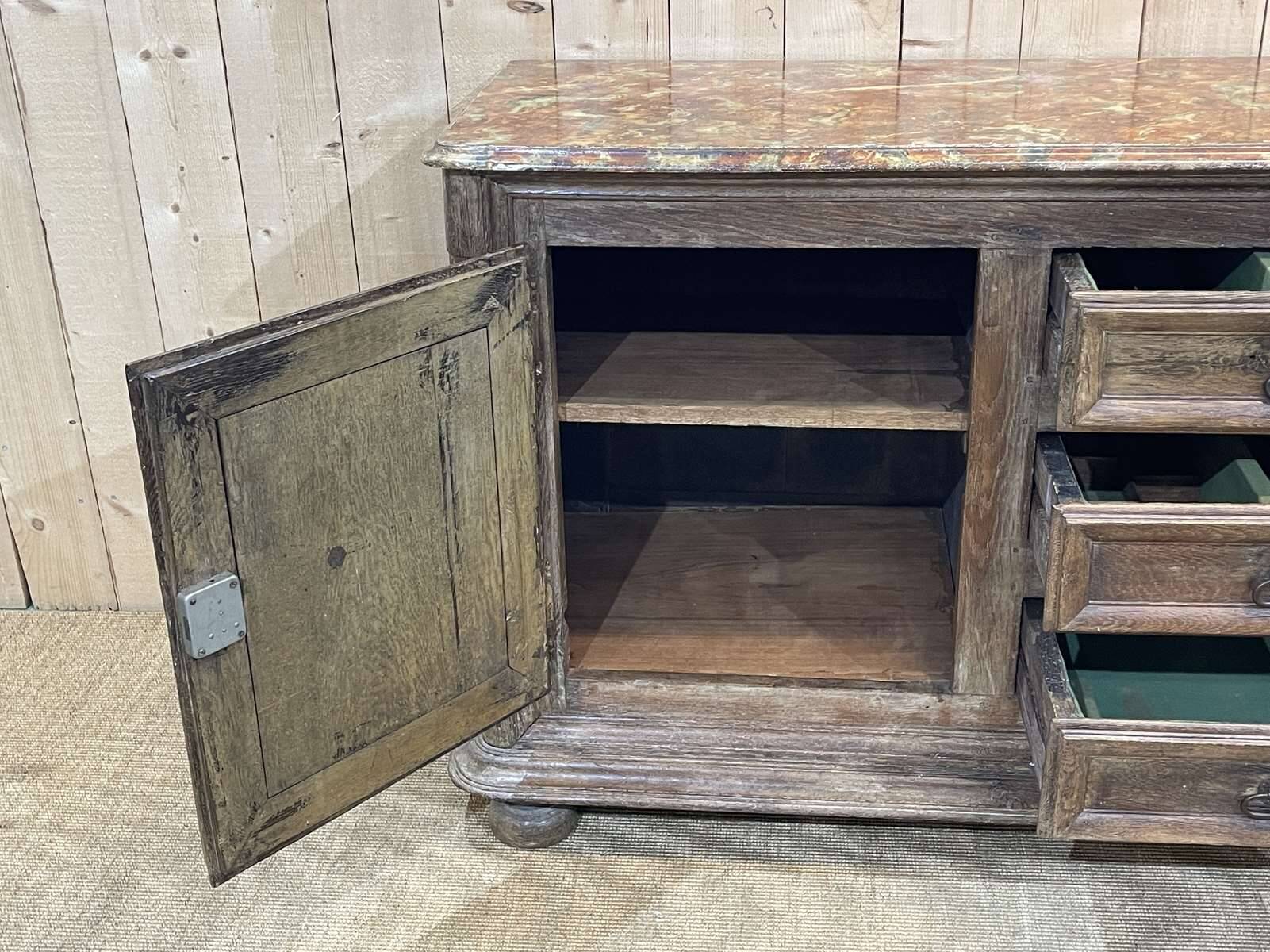 18th-century oak enfilade with a marble-effect painted top.