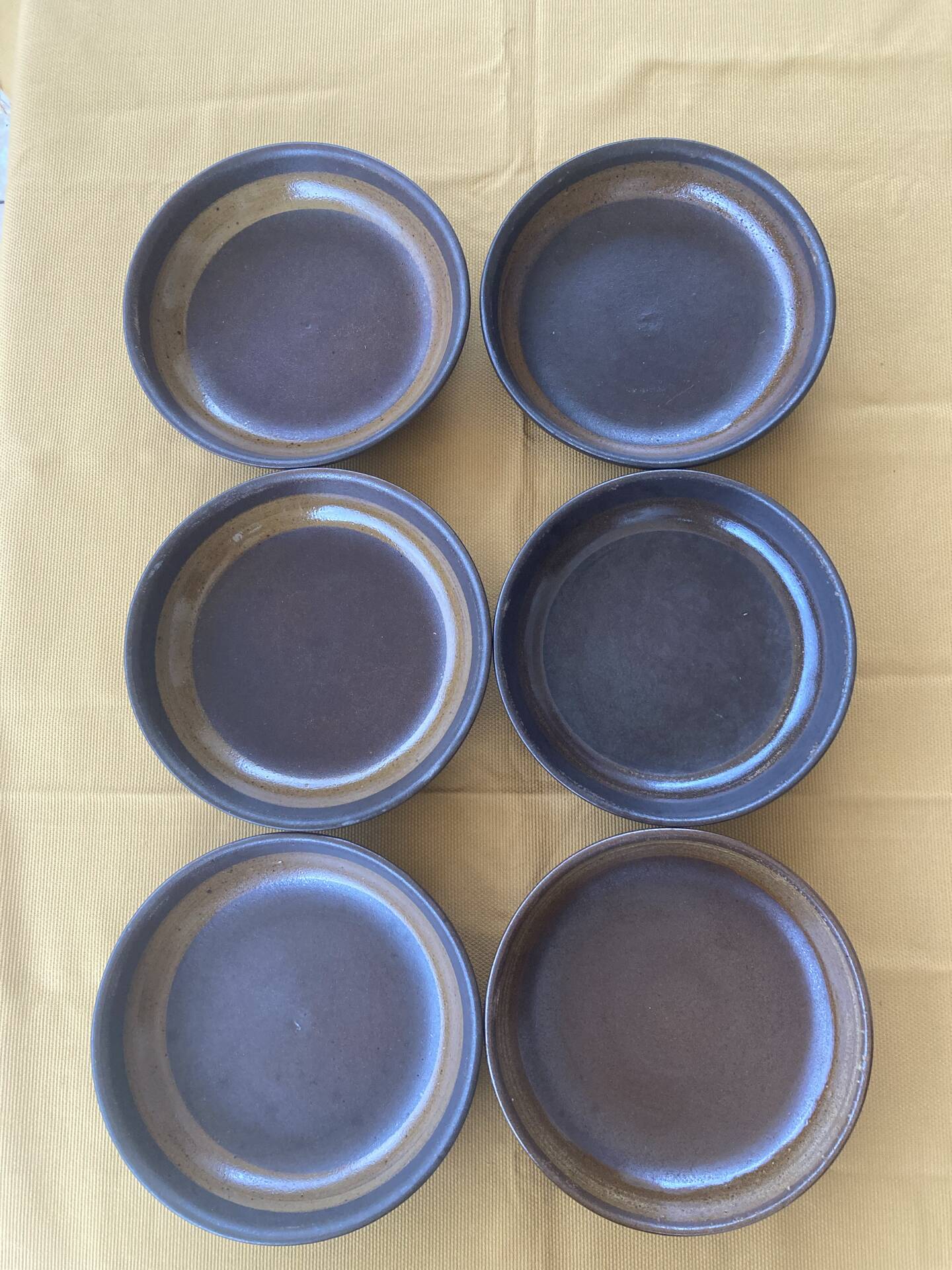 Organic earthenware deep plates from Gré du Marais, France.