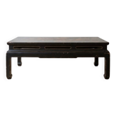 Antique Chinese coffee table in black and gold painted wood.