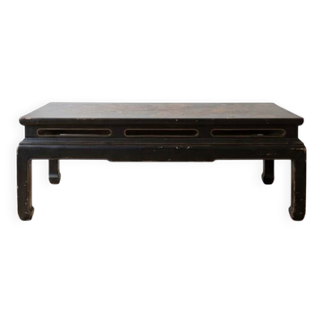 Antique Chinese coffee table in black and gold painted wood.