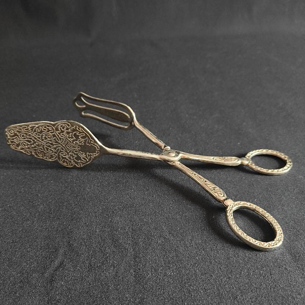 Engraved metal cake pliers