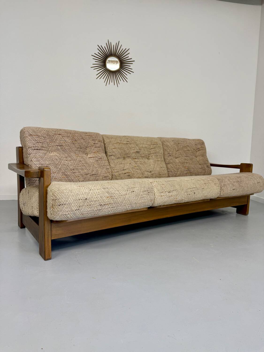 Old 3-seater sofa in solid wood, Maison Regain design, from the 70s.