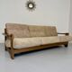 Old 3-seater sofa in solid wood, Maison Regain design, from the 70s.