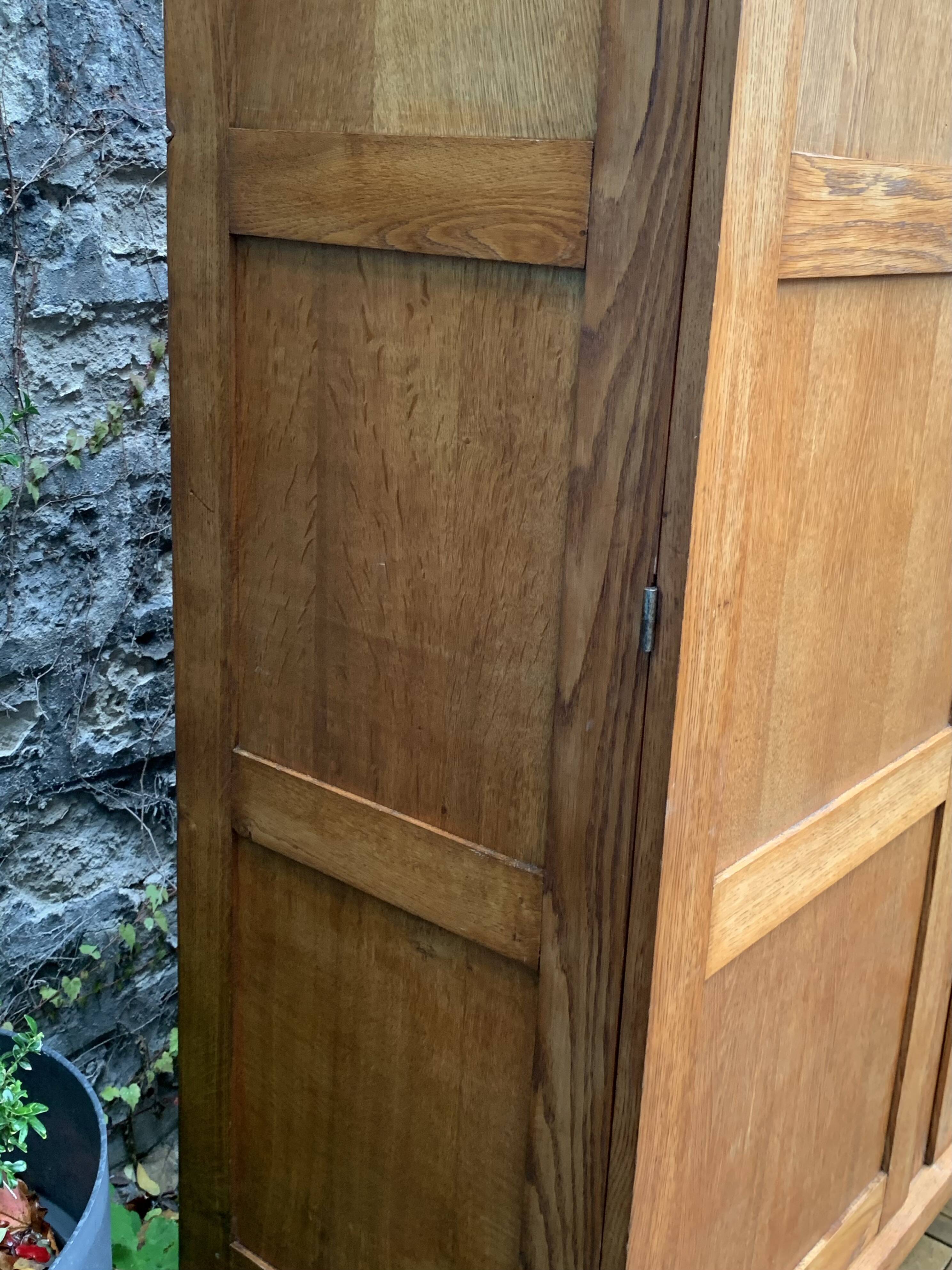 Solid oak compass foot cabinet René Gabriel 1945