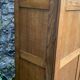 Solid oak compass foot cabinet René Gabriel 1945