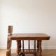Antique extendable dining table made of solid wood.